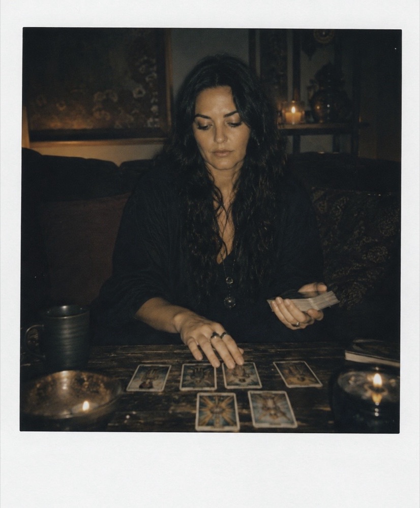 Polaroid of Chaya mid-reading at her table