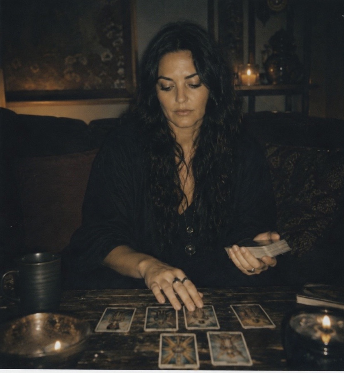The founder's reading table, cards laid out by candlelight